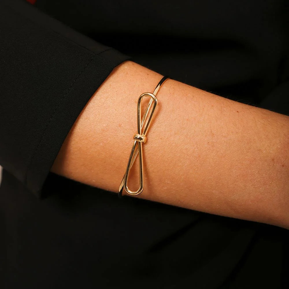 Elegant 18k Gold Plated Adjustable Loop Bracelet Ireland worn on an arm, showcasing its stylish design.