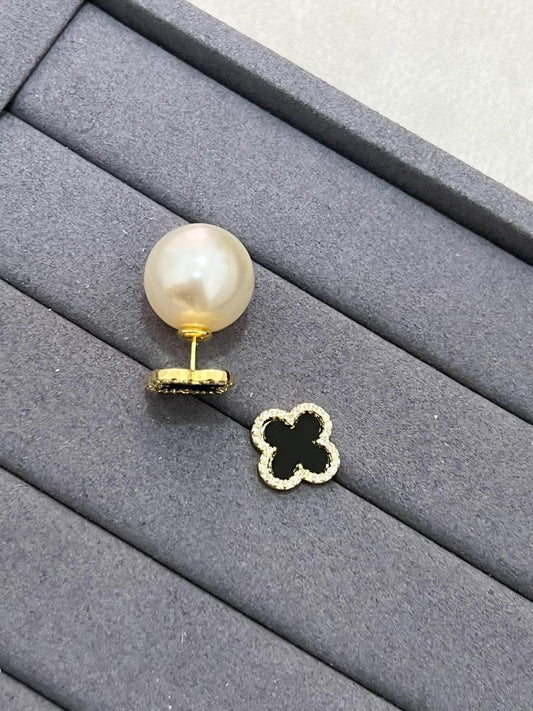 18k Gold Plated Black Clover Earring Studded with Pearl Ireland on a stylish display