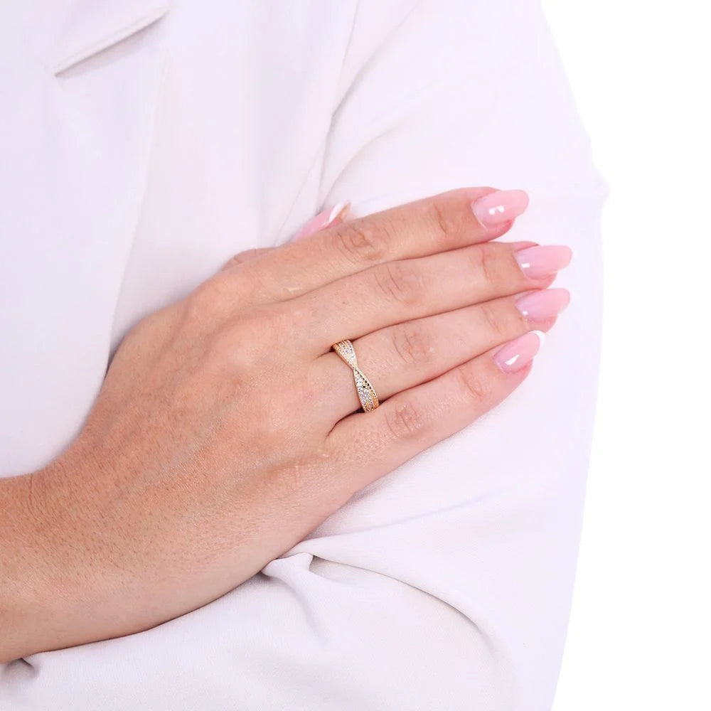 Beautiful 18k Gold Plated Twisted Ring Ireland worn on a hand with manicured nails.