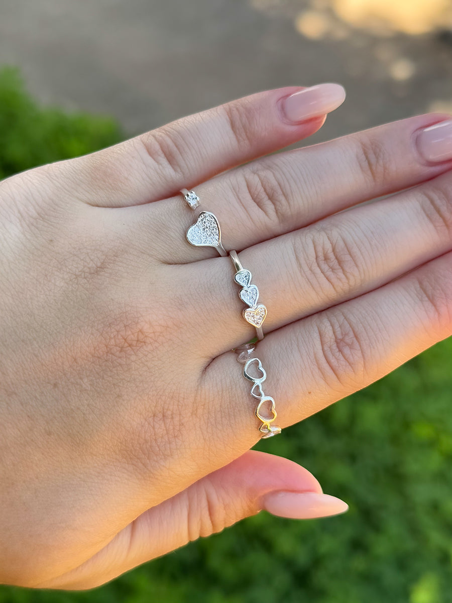 Tamis Jewellery 925k Silver Hollow Hearts Ring Ireland Online showcasing delicate heart designs on a hand