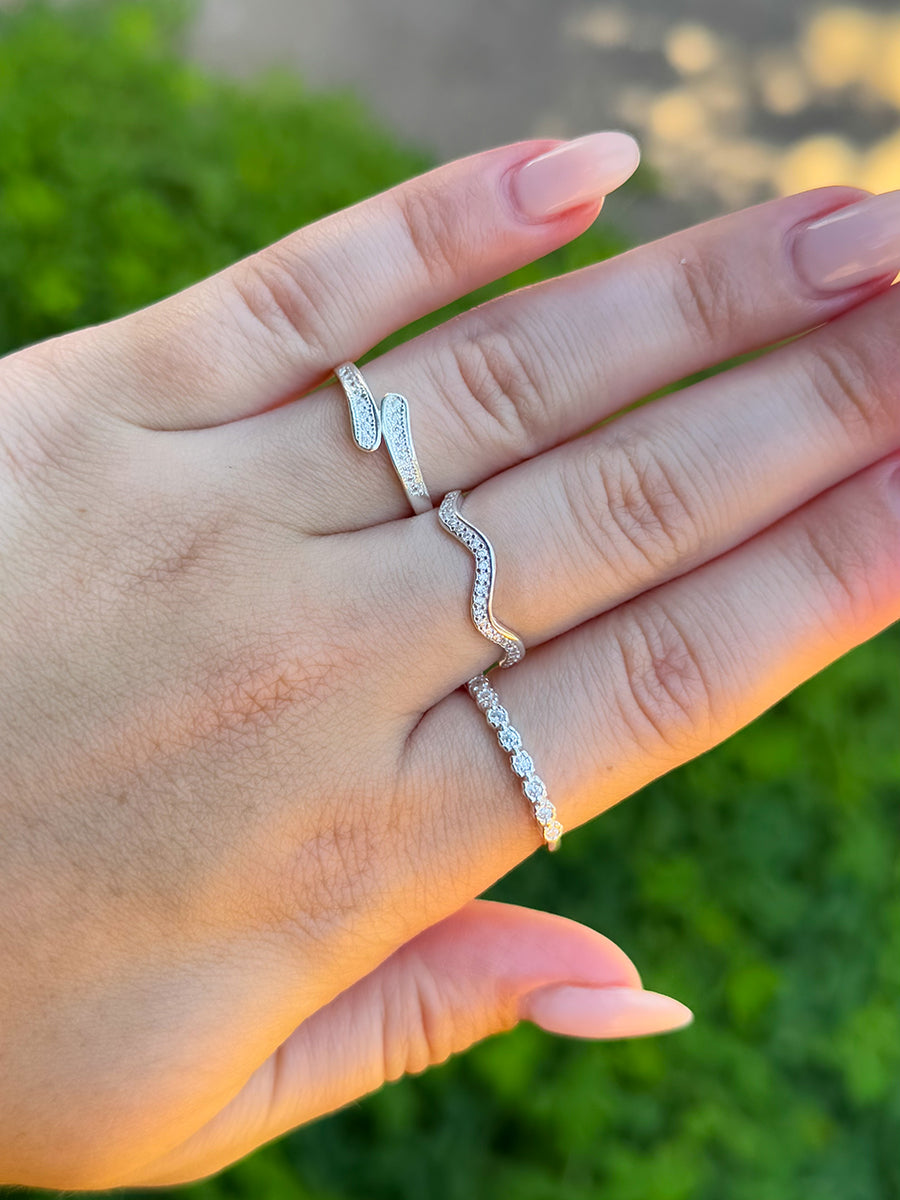 Tamis Jewellery 925k Silver Studded Wavy Ring Ireland Online displayed on a hand with other rings