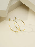Detail of 18K gold plated half hoop earring – Brazilian-made in Dublin
