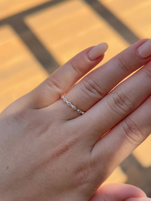 Silver zirconia ring paired with other bands - Dublin jewelry trend